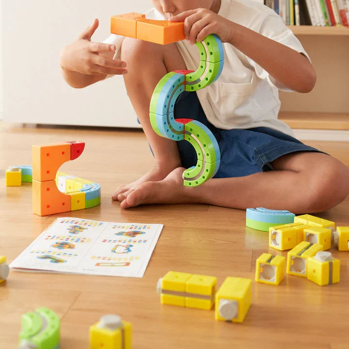 Kid building tracks